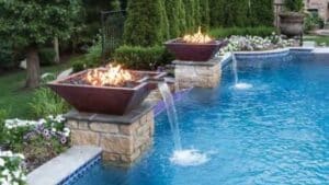 Pool features hammered water fire vessel