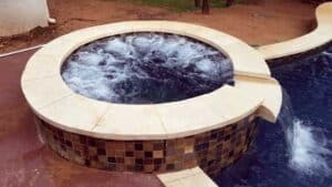 Pool features hot tub